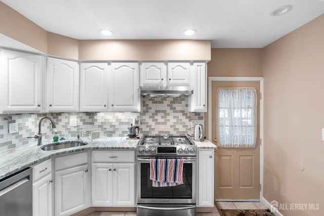 13 Quincy Rd, East Brunswick, NJ 08816 - kitchen featuring stainless steel appliances, light stone counters, backsplash, white cabinets, and recessed lighting