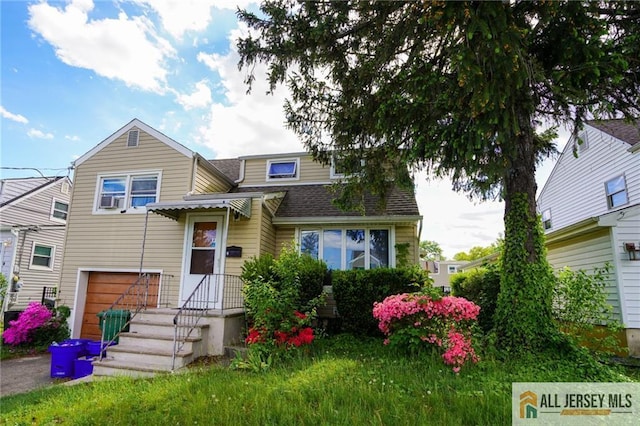 5 Gardner Pl, Sayreville, NJ 08859 - view of front of house featuring an attached garage and a shingled roof