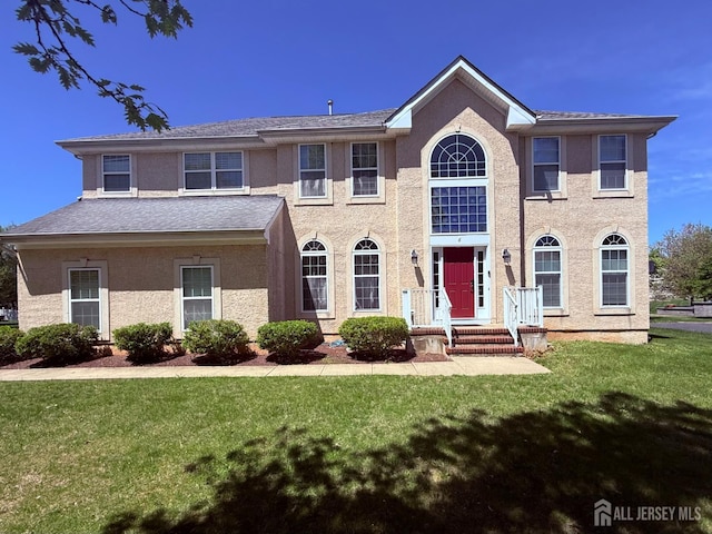 6 Mahogany Ct, Plainsboro, NJ 08536 - view of front of house with a front yard and stucco siding