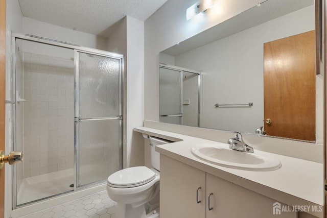 352 Lancaster Ct, Piscataway, NJ 08854 - bathroom with vanity, a stall shower, toilet, a textured ceiling, and tile patterned floors