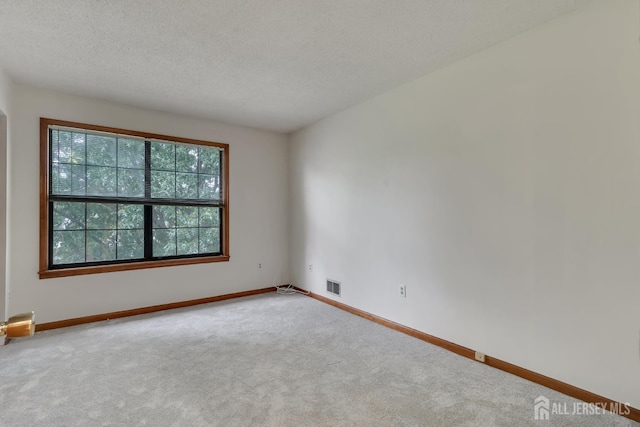352 Lancaster Ct, Piscataway, NJ 08854 - spare room with carpet floors, baseboards, and a textured ceiling