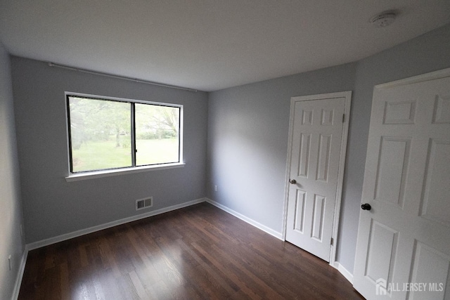 4319 Birchwood Ct, North Brunswick, NJ 08902 - unfurnished bedroom featuring dark wood-type flooring