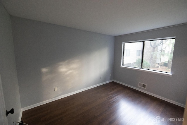 4319 Birchwood Ct, North Brunswick, NJ 08902 - empty room with dark wood-style floors and baseboards