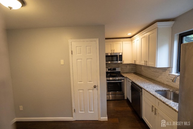 4319 Birchwood Ct, North Brunswick, NJ 08902 - kitchen with appliances with stainless steel finishes, dark wood finished floors, white cabinetry, light stone counters, and recessed lighting