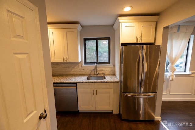 4319 Birchwood Ct, North Brunswick, NJ 08902 - kitchen with stainless steel appliances, dark wood-style floors, light stone countertops, white cabinets, and tasteful backsplash