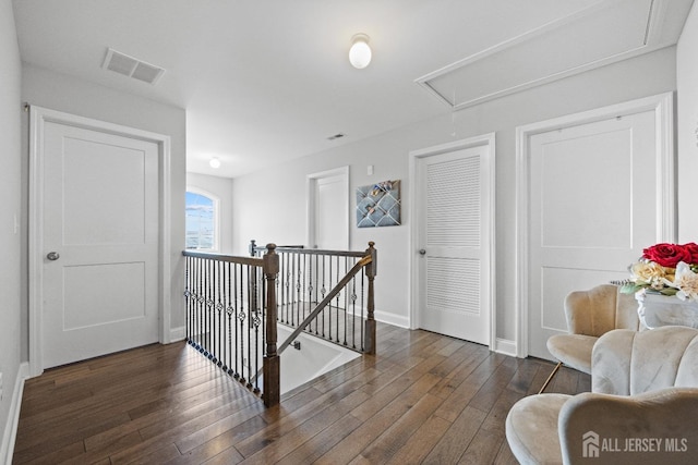 767 Coolidge Ave, Woodbridge Proper, NJ 07095 - hall featuring an upstairs landing, attic access, dark wood-style floors, and baseboards