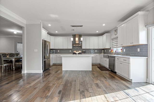 767 Coolidge Ave, Woodbridge Proper, NJ 07095 - kitchen with appliances with stainless steel finishes, wall chimney exhaust hood, light countertops, backsplash, and dark wood-type flooring