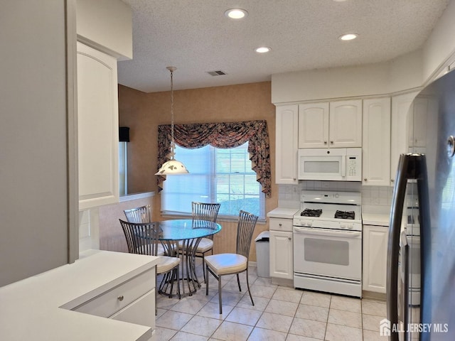 47 Birmingham Ln, Monroe, NJ 08831 - kitchen featuring white appliances, white cabinetry, a textured ceiling, light countertops, and recessed lighting