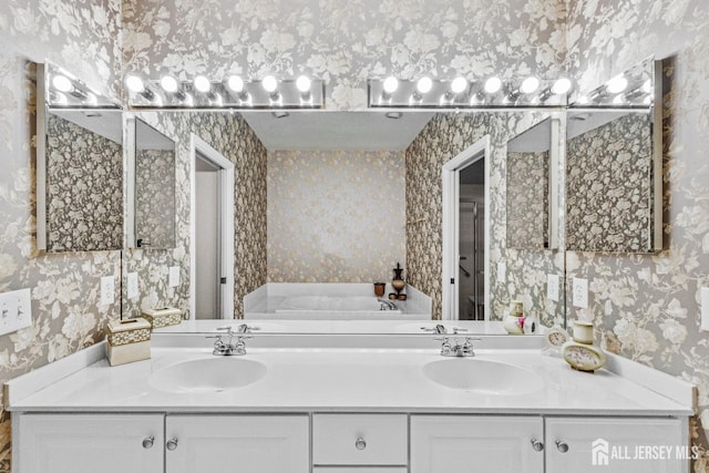 47 Birmingham Ln, Monroe, NJ 08831 - bathroom with wallpapered walls, double vanity, and a bath