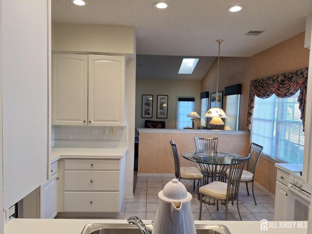 47 Birmingham Ln, Monroe, NJ 08831 - dining room featuring a skylight, light tile patterned floors, and recessed lighting