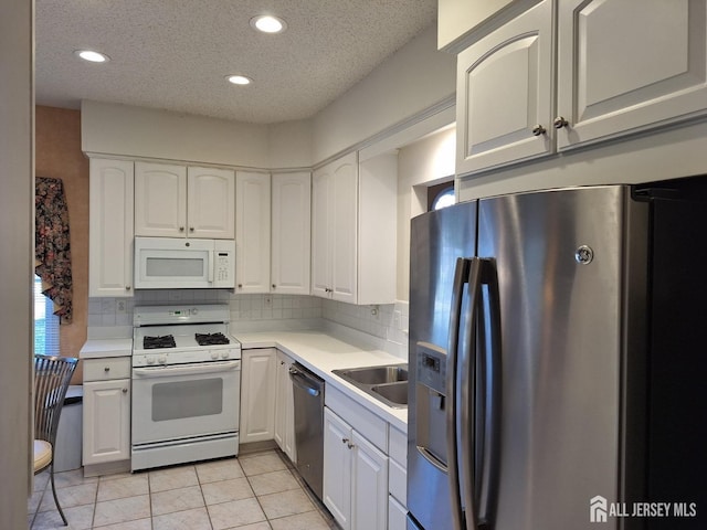 47 Birmingham Ln, Monroe, NJ 08831 - kitchen with stainless steel appliances, white cabinetry, recessed lighting, tasteful backsplash, and light countertops