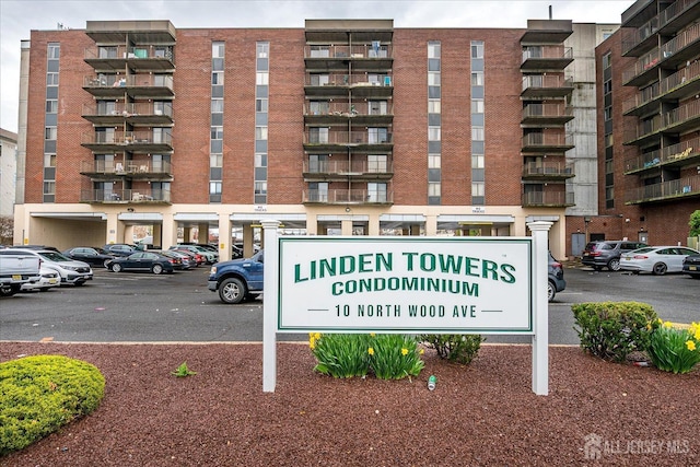 community sign with uncovered parking