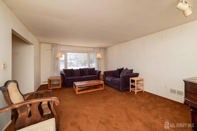 living room with carpet flooring and visible vents