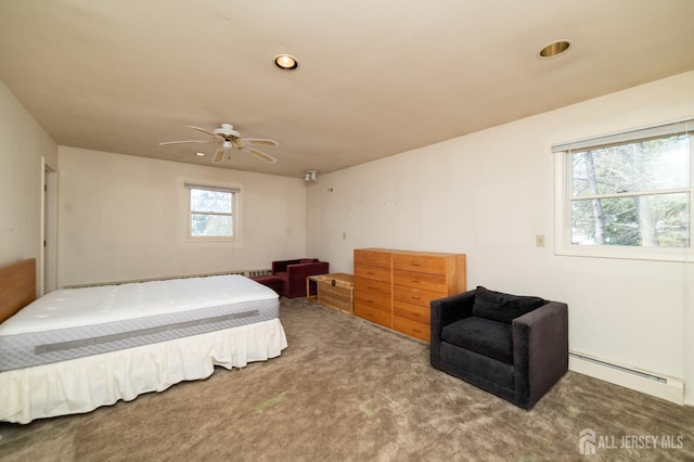 carpeted bedroom with a baseboard radiator, recessed lighting, and ceiling fan