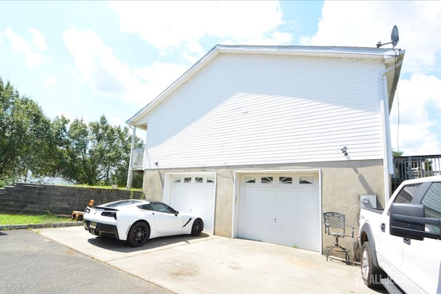 view of side of home with a garage