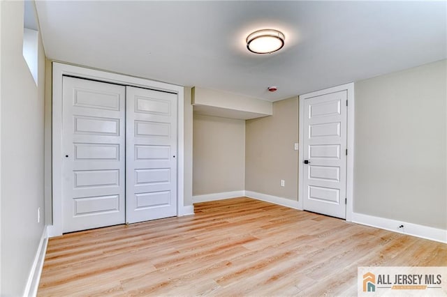 32 Campbell Ave, Edison, NJ 08817 - unfurnished bedroom with wood finished floors, baseboards, and a closet