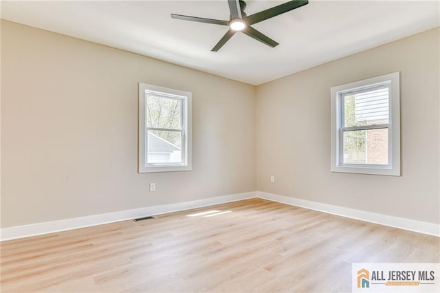 32 Campbell Ave, Edison, NJ 08817 - empty room with healthy amount of natural light, light wood-type flooring, a ceiling fan, and baseboards