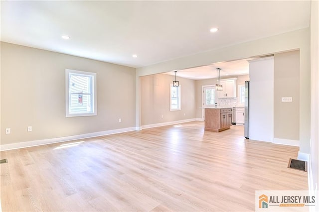 32 Campbell Ave, Edison, NJ 08817 - unfurnished living room featuring baseboards, light wood-style flooring, and recessed lighting