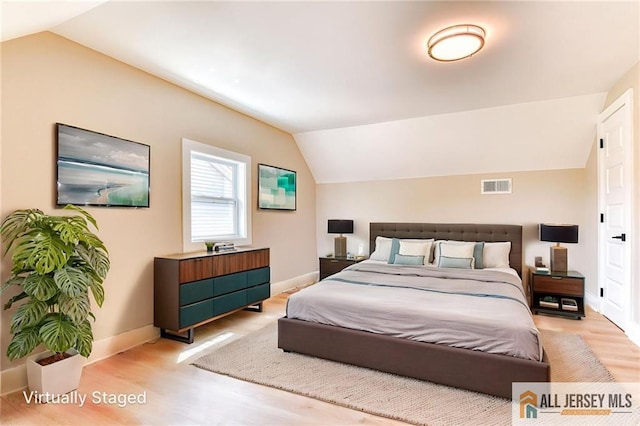 32 Campbell Ave, Edison, NJ 08817 - bedroom with lofted ceiling, wood finished floors, and baseboards