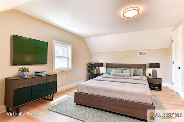 32 Campbell Ave, Edison, NJ 08817 - bedroom with vaulted ceiling, light wood-style floors, and baseboards