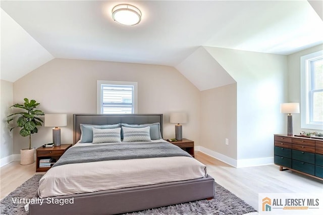 32 Campbell Ave, Edison, NJ 08817 - bedroom with light wood-style floors, vaulted ceiling, and baseboards