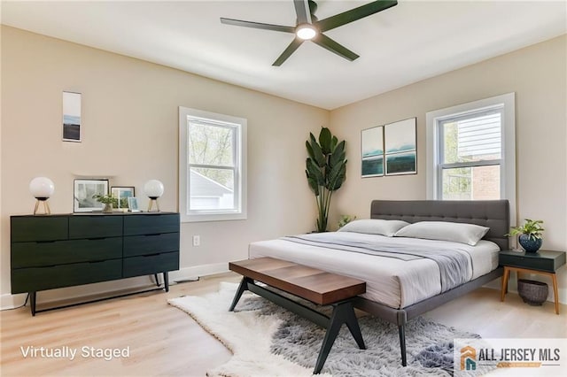 32 Campbell Ave, Edison, NJ 08817 - bedroom featuring multiple windows, light wood finished floors, baseboards, and a ceiling fan