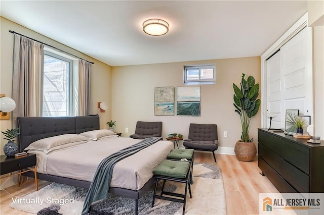 32 Campbell Ave, Edison, NJ 08817 - bedroom featuring multiple windows, light wood-style flooring, and baseboards