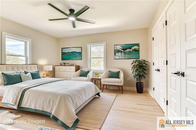 32 Campbell Ave, Edison, NJ 08817 - bedroom featuring light wood-style floors, baseboards, a closet, and a ceiling fan