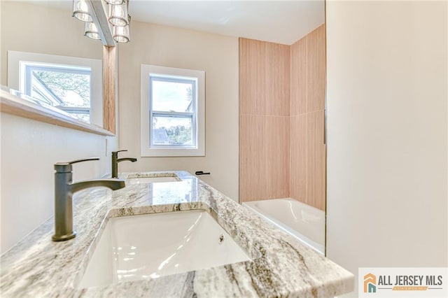 32 Campbell Ave, Edison, NJ 08817 - bathroom featuring double vanity and a chandelier