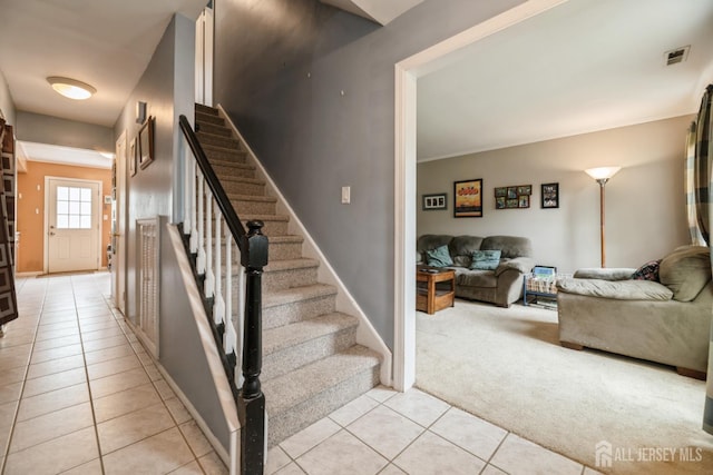 3 Pond View Dr, Plainsboro, NJ 08536 - stairs with tile patterned flooring, carpet flooring, baseboards, and ornamental molding