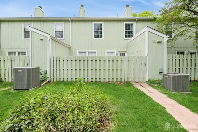 3 Pond View Dr, Plainsboro, NJ 08536 - back of house featuring central air condition unit and a chimney