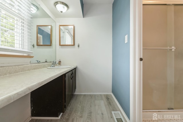 3 Pond View Dr, Plainsboro, NJ 08536 - bathroom with wood finished floors, vanity, and baseboards