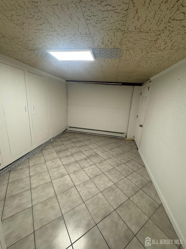 99 Holly St, Port Reading, NJ 07064 - finished basement featuring a baseboard heating unit