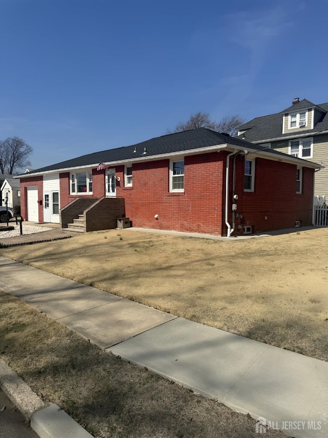 view of front of home with brick siding