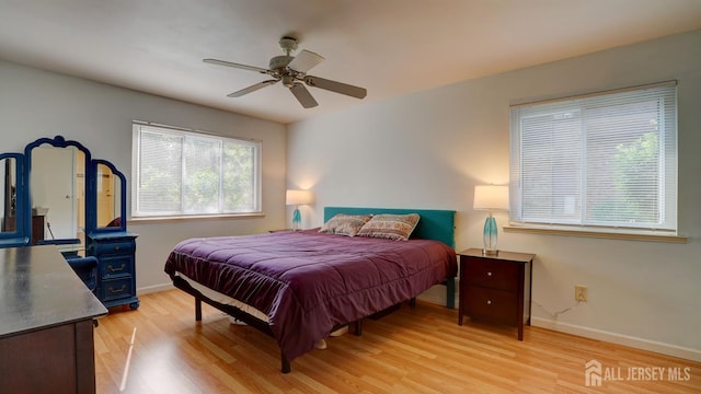 2413 Old Stone Mill Dr, East Windsor, NJ 08512 - bedroom featuring light wood-style flooring, baseboards, and ceiling fan