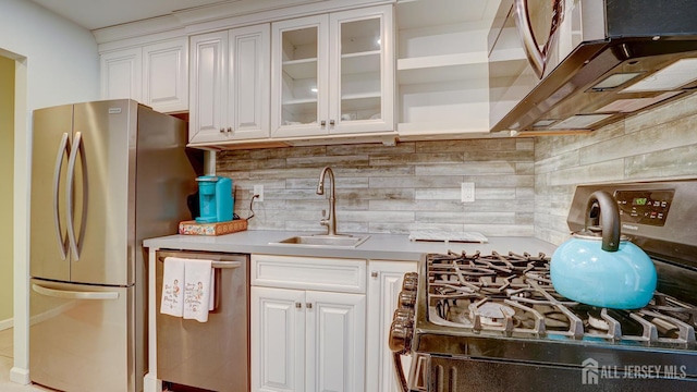 2413 Old Stone Mill Dr, East Windsor, NJ 08512 - kitchen featuring appliances with stainless steel finishes, a sink, white cabinetry, and light countertops