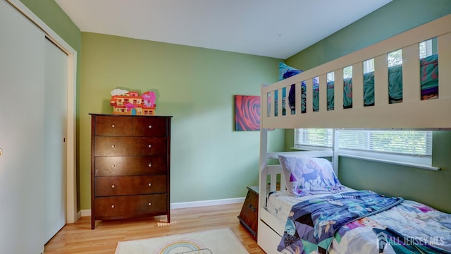 2413 Old Stone Mill Dr, East Windsor, NJ 08512 - bedroom with light wood finished floors and baseboards
