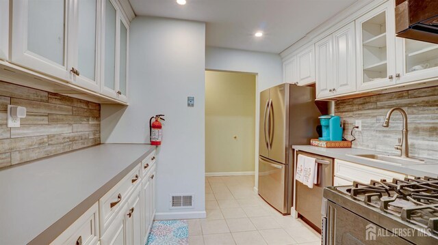 2413 Old Stone Mill Dr, East Windsor, NJ 08512 - kitchen with a sink, light countertops, white cabinets, tasteful backsplash, and recessed lighting