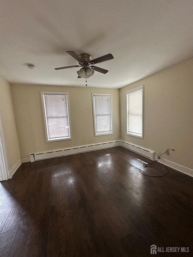 111 Joyce Kilmer Ave, New Brunswick, NJ 08901 - spare room featuring baseboards, a ceiling fan, dark wood-type flooring, and a smoke detector
