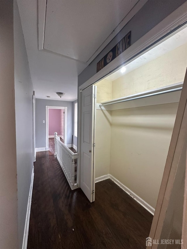 111 Joyce Kilmer Ave, New Brunswick, NJ 08901 - corridor featuring an upstairs landing, attic access, wood finished floors, and baseboards