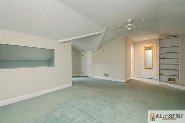 130 Sayre Dr, Plainsboro, NJ 08540 - additional living space with ceiling fan, lofted ceiling, carpet, baseboards, and a textured ceiling