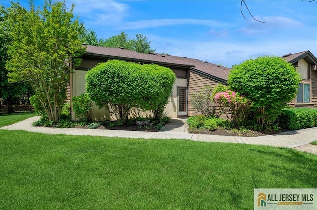 130 Sayre Dr, Plainsboro, NJ 08540 - obstructed view of property with a front lawn and stucco siding