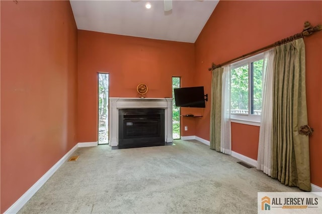 130 Sayre Dr, Plainsboro, NJ 08540 - unfurnished living room featuring healthy amount of natural light, ceiling fan, high vaulted ceiling, and carpet floors