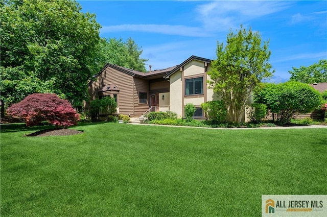 130 Sayre Dr, Plainsboro, NJ 08540 - view of front of house with stucco siding and a front yard