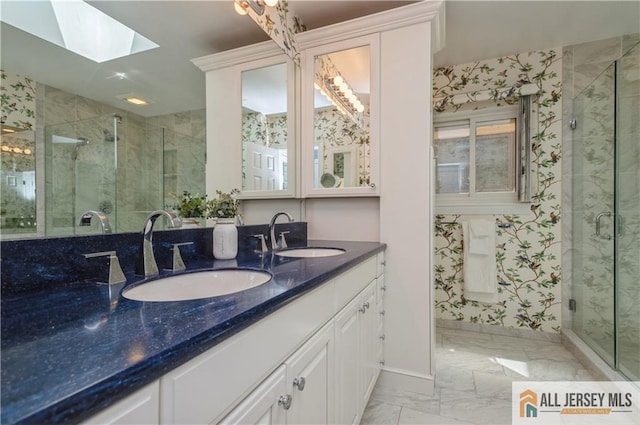 130 Sayre Dr, Plainsboro, NJ 08540 - full bath with a skylight, a stall shower, marble finish flooring, and double vanity