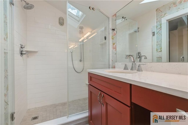 130 Sayre Dr, Plainsboro, NJ 08540 - full bathroom with a skylight, a tile shower, and vanity