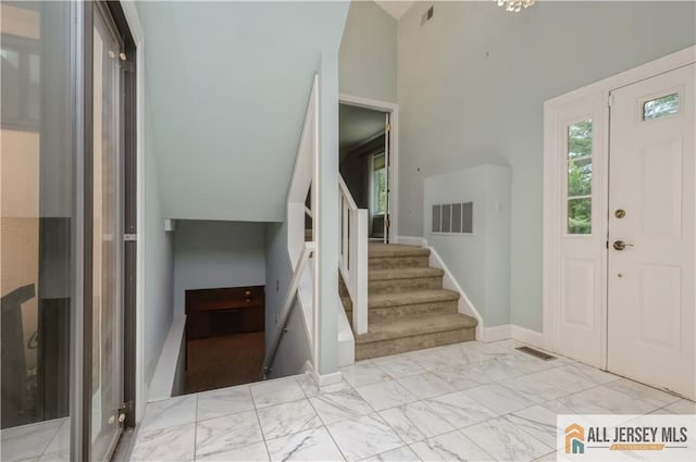 130 Sayre Dr, Plainsboro, NJ 08540 - entrance foyer with stairs, light marble finish flooring, and lofted ceiling