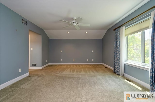 130 Sayre Dr, Plainsboro, NJ 08540 - spare room featuring ceiling fan, carpet floors, vaulted ceiling, and baseboards