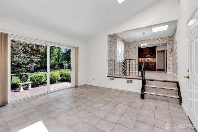 30 Daniel Dr, Matawan, NJ 07747 - empty room with lofted ceiling, wallpapered walls, light tile patterned floors, and a skylight