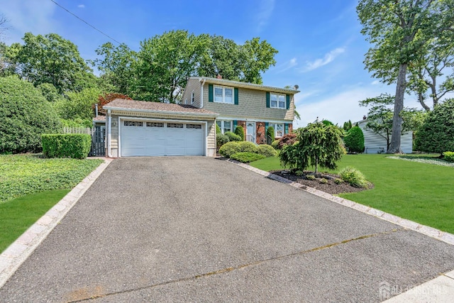 30 Daniel Dr, Matawan, NJ 07747 - view of front facade featuring an attached garage, driveway, and a front yard
